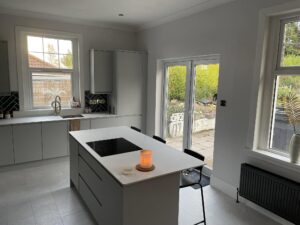 Modern kitchen with island and natural light.